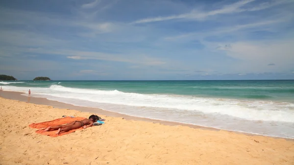 Foreign woman got tan on beach in Phuket