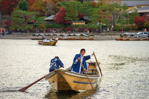 Japanese oar people sail boat at Arashiyama
