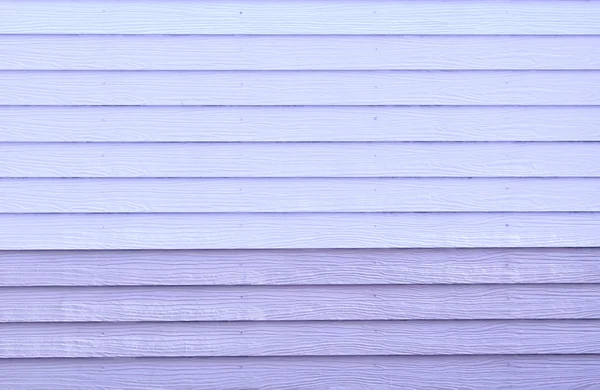 Artificial purple wood wall background texture