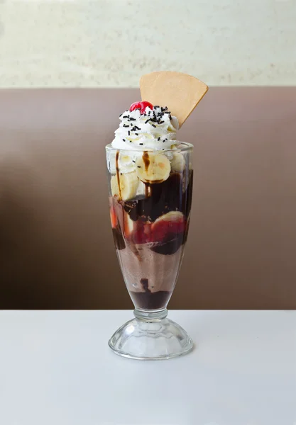 Ice cream sundae with cherry and banana topping