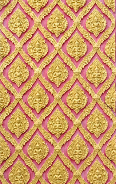 Traditional Thai style gold angels pattern on Thai public temple