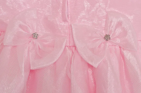 Pink bows on pink baby dress