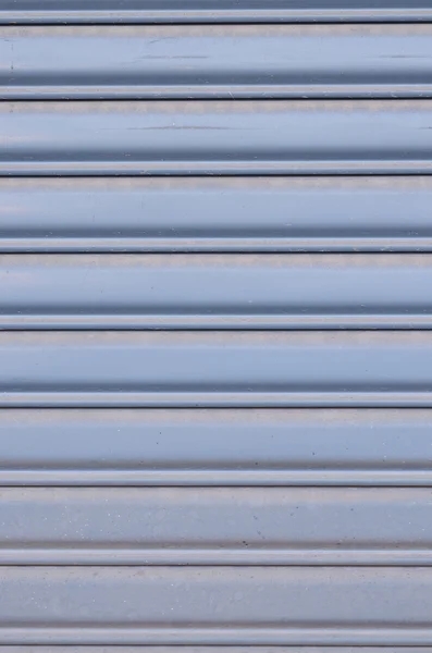Grungy metal sheet slide door
