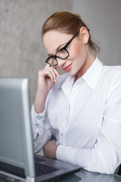 Sexy blonde businesswoman online flirt in office