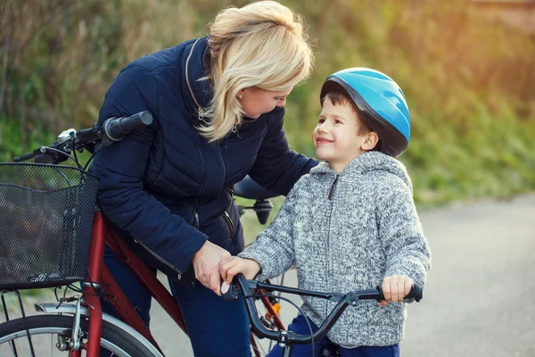 Family of mother and son biking