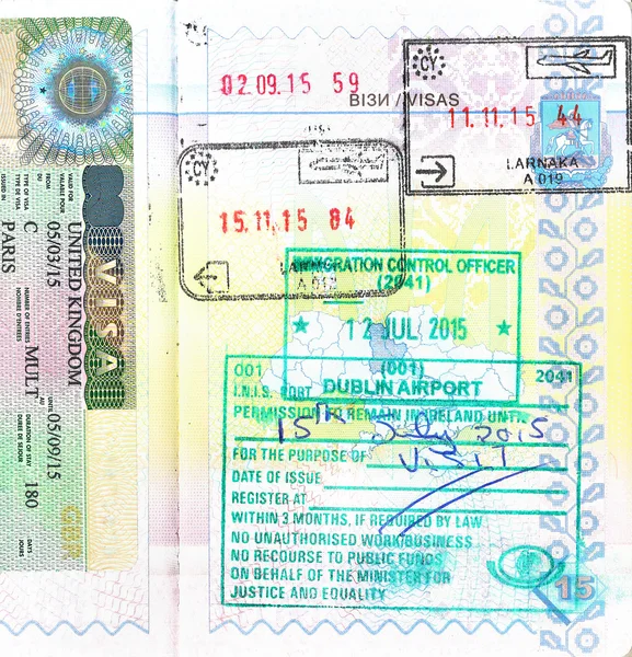 Passport with UK visa and stamps of Cyprus, Ireland