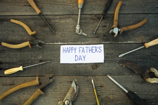 Desk of a carpenter with Happy fathers day sign.