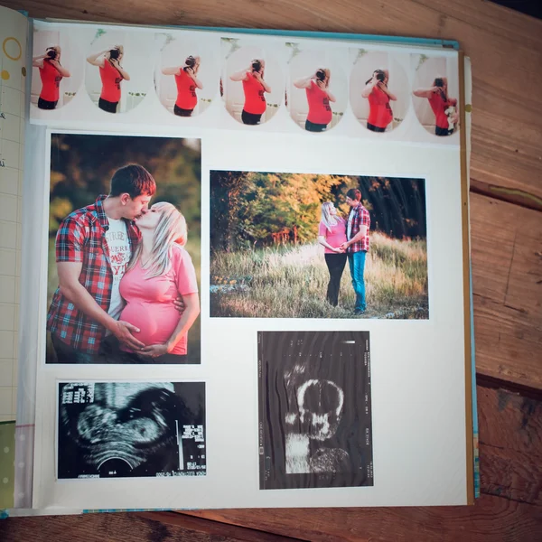 Photo album with family photos during pregnancy