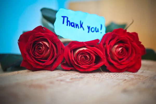 Thank you card and red roses