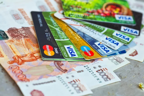 KIEV, UKRAINE - on June 15: Heap of credit cards, Visas and MasterCard,, Ukraine, on june 15, 2015.Pile of Visa credit cards. Visa and master card is biggest credit card.
