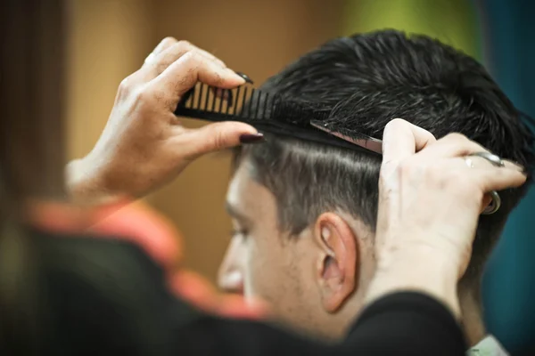 Men\'s haircut at the barber scissors