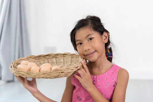 Asian child playing a chef at home