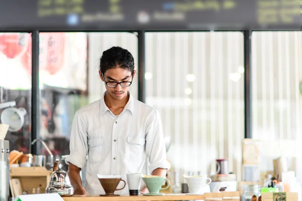 Barista brews a single cup a coffee house employee brew a single