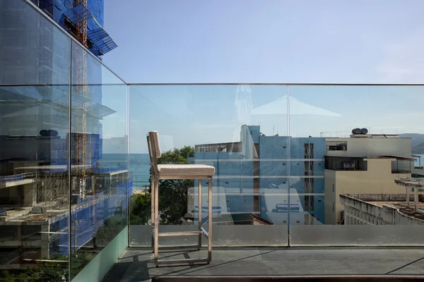 Stainless steel on sunny terrace with bay view and decoration in contemporary home