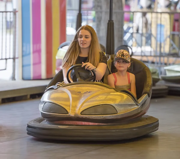 Mother with daughter ride attraction \