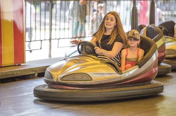 Mother with daughter ride attraction \
