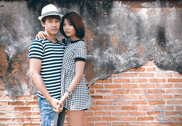 Portrait of attractive asian couple in old town
