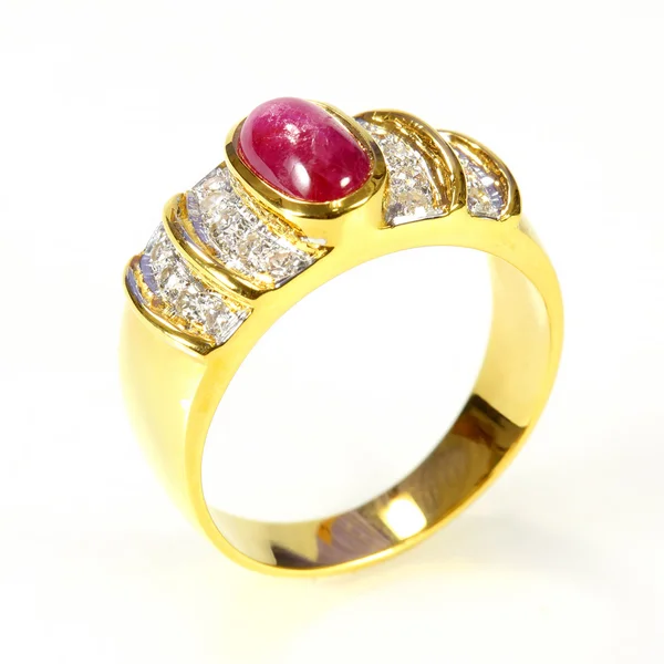 Gold ring with ruby and diamond on white background