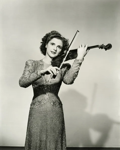 Young woman plays violin