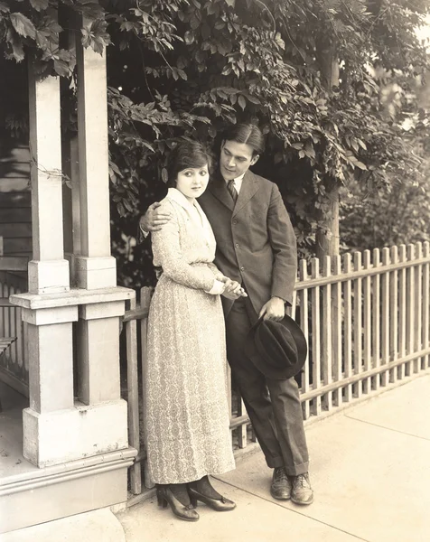 Man and woman standing outdoors