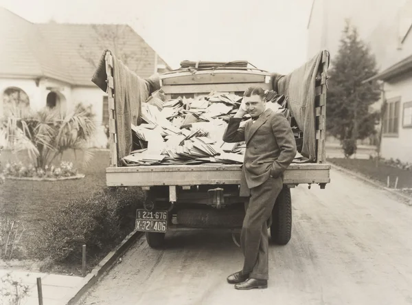 Man standing by Truck load of mail