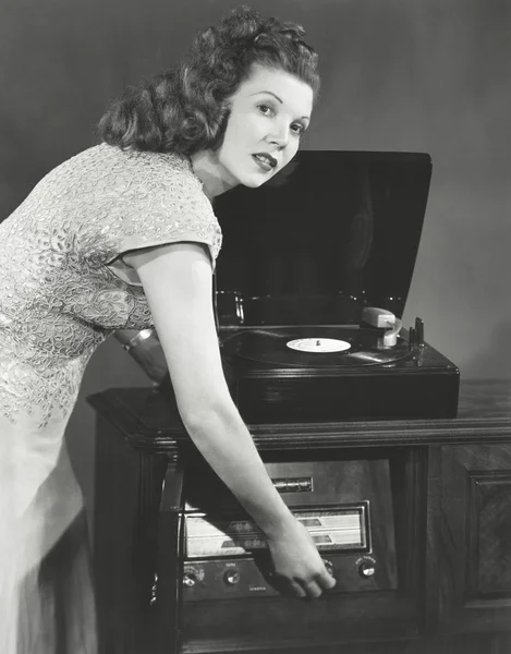 Woman playing record album