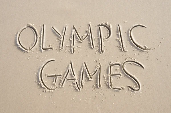 Olympic Games Message Handwritten in Sand