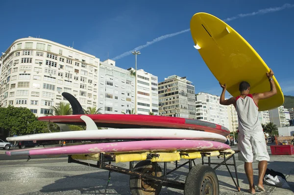 Brazilian Man Unloading Surfboards Copacabana Rio Brazil