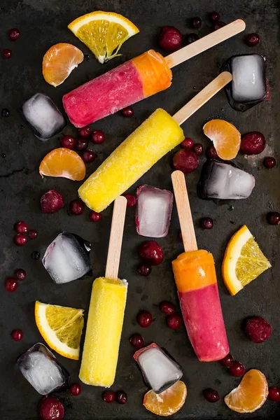 Delicious fruit ice pop with orange and cranberries