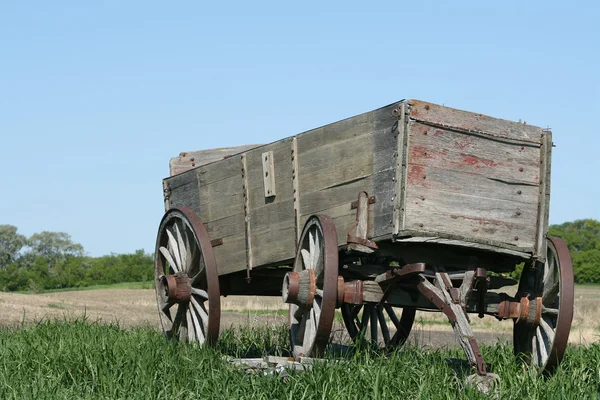 Abandoned Wooden Wagon in a Field