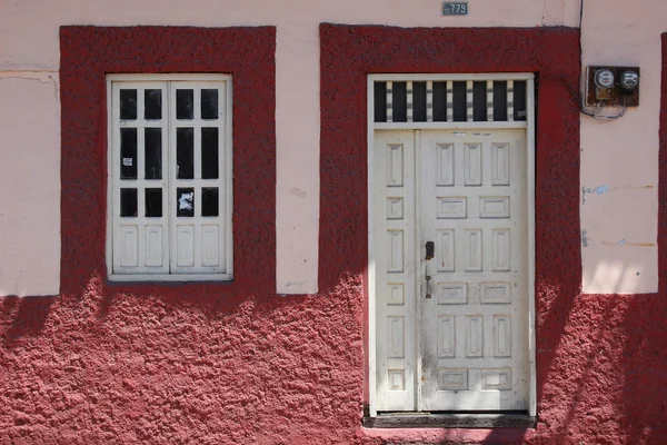 White Door and Window in a Wall