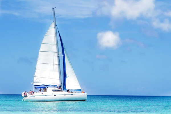 Sea yacht on tropical sea and sky background