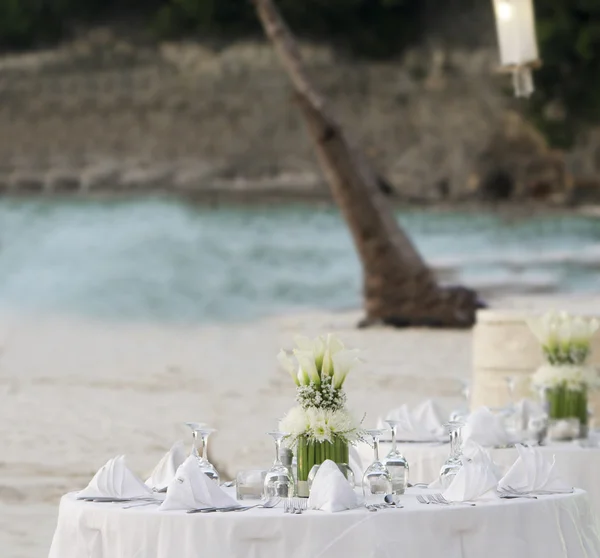 Wedding table decoration in open air restaurant on beach