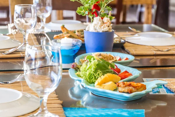 Table setup in outdoor cafe, small restaurant in a hotel, summer