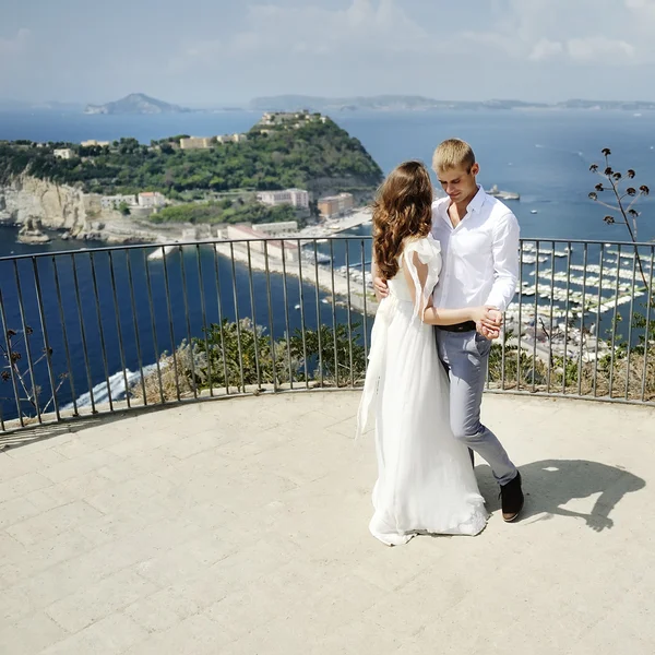 Bride and groom dancing in wedding day in Naples, Italy