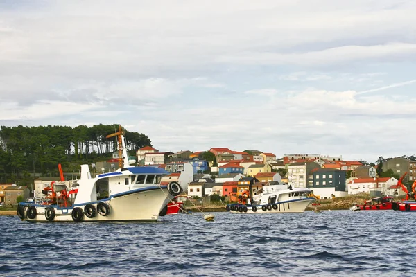Mussel aquaculture boats anchored on Pesqueira, Cabodecruz