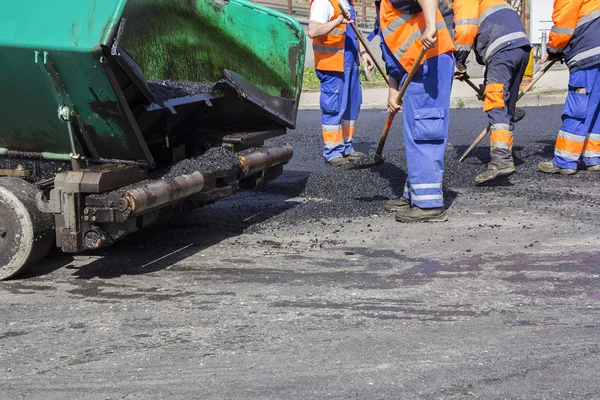 Workers on Asphalting road