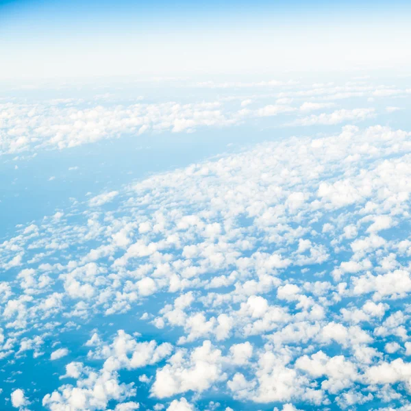 Sky. View from window of airplane flying in clouds