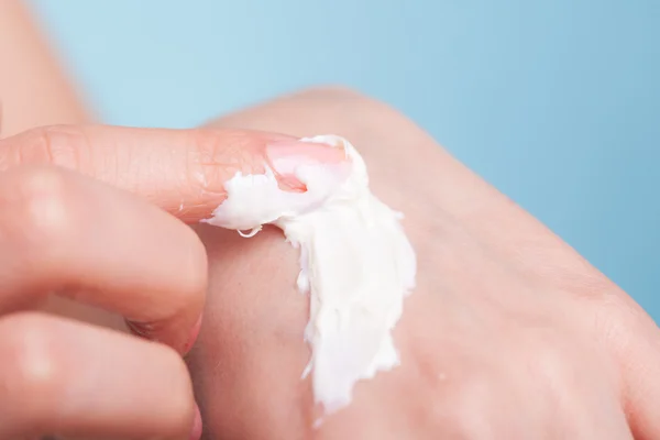 Skin care. Female palms with moisturizing cream.