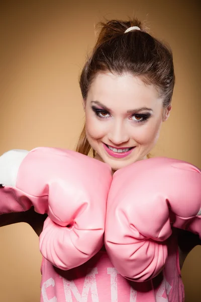 Boxer wearing big  pink gloves