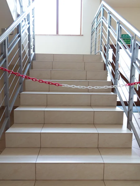 Entrance stairs closed with rope, no entry sign.
