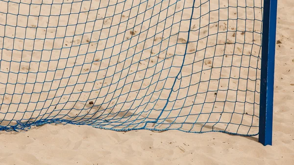 Football summer sport. goal net on a sandy beach