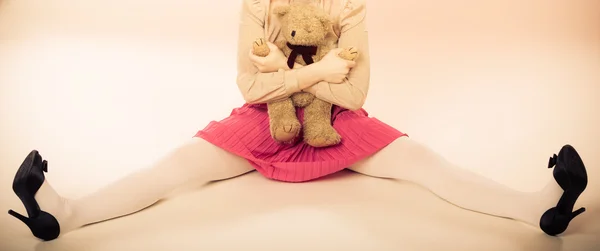 Woman holding teddy bear toy