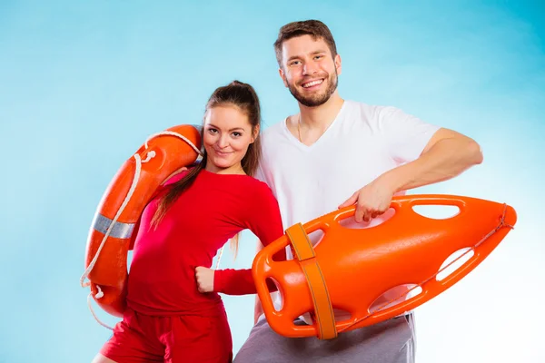 Couple holding  lifesaver equipment