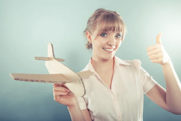 Woman  holding airplane