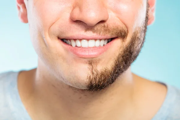 Happy man with half shaved face beard hair.