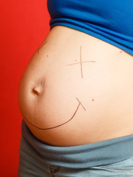 Tummy with painted smiley face