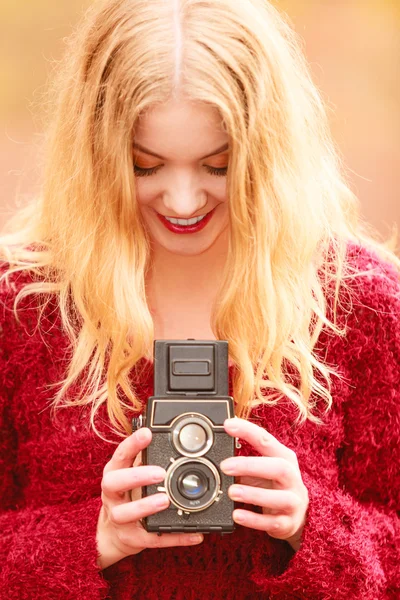 Woman  with old vintage camera