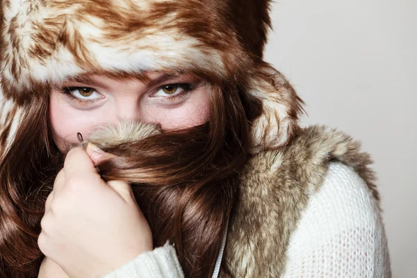 Attractive woman in fur cap