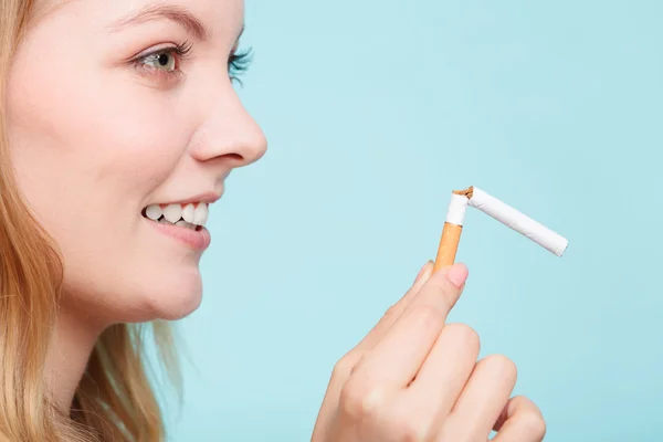 Girl breaking down cigarette